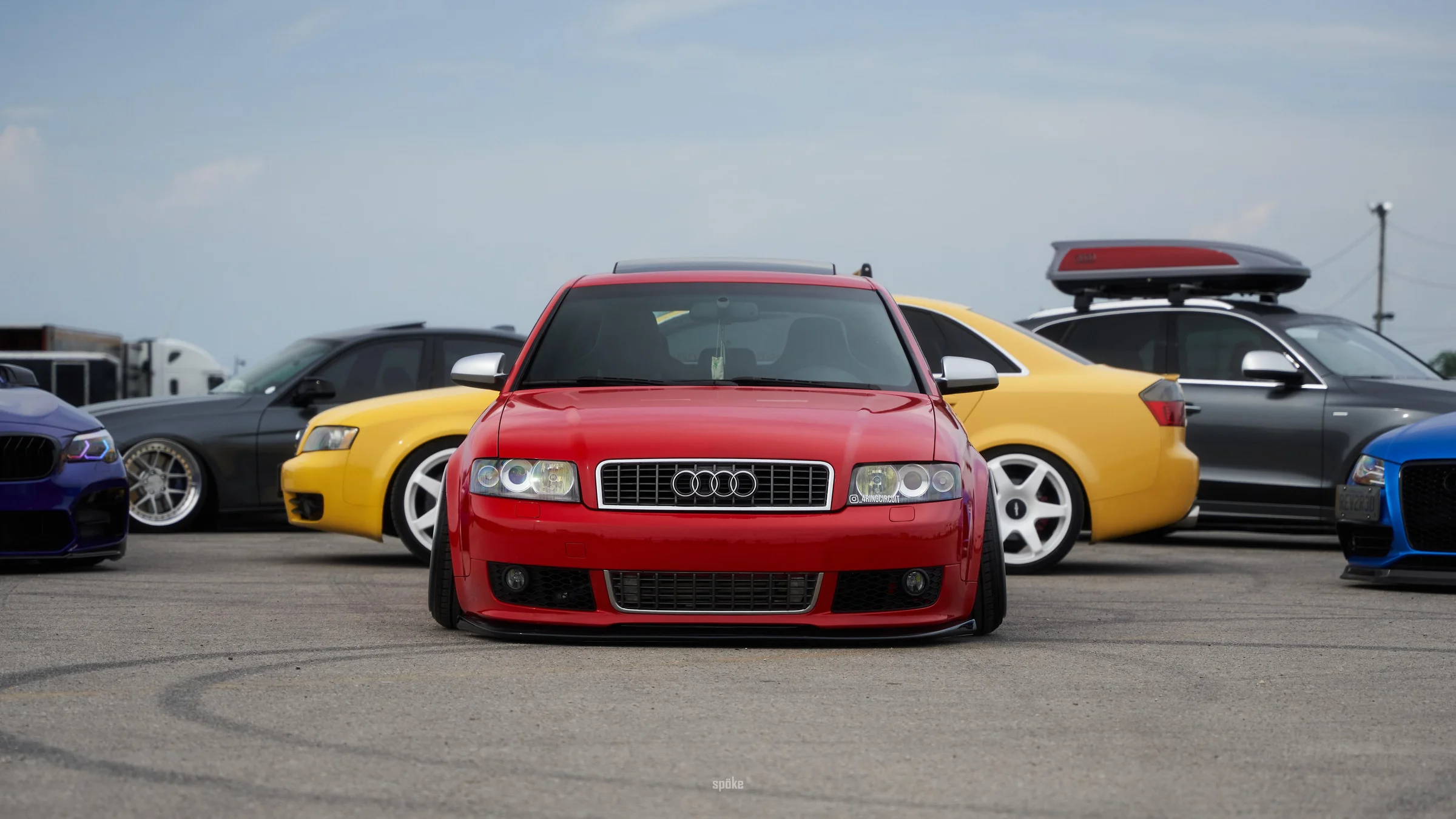 Red Audi at an automotive gathering