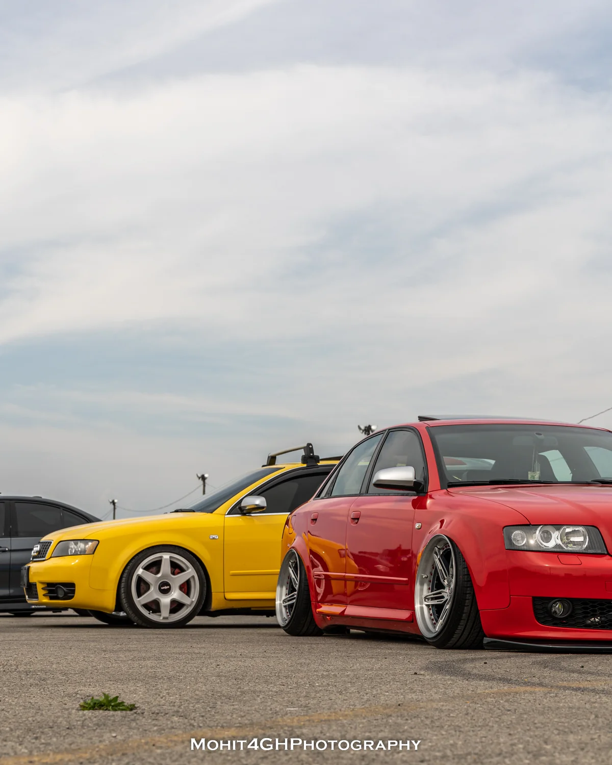 Red and yellow Audis at a car gathering